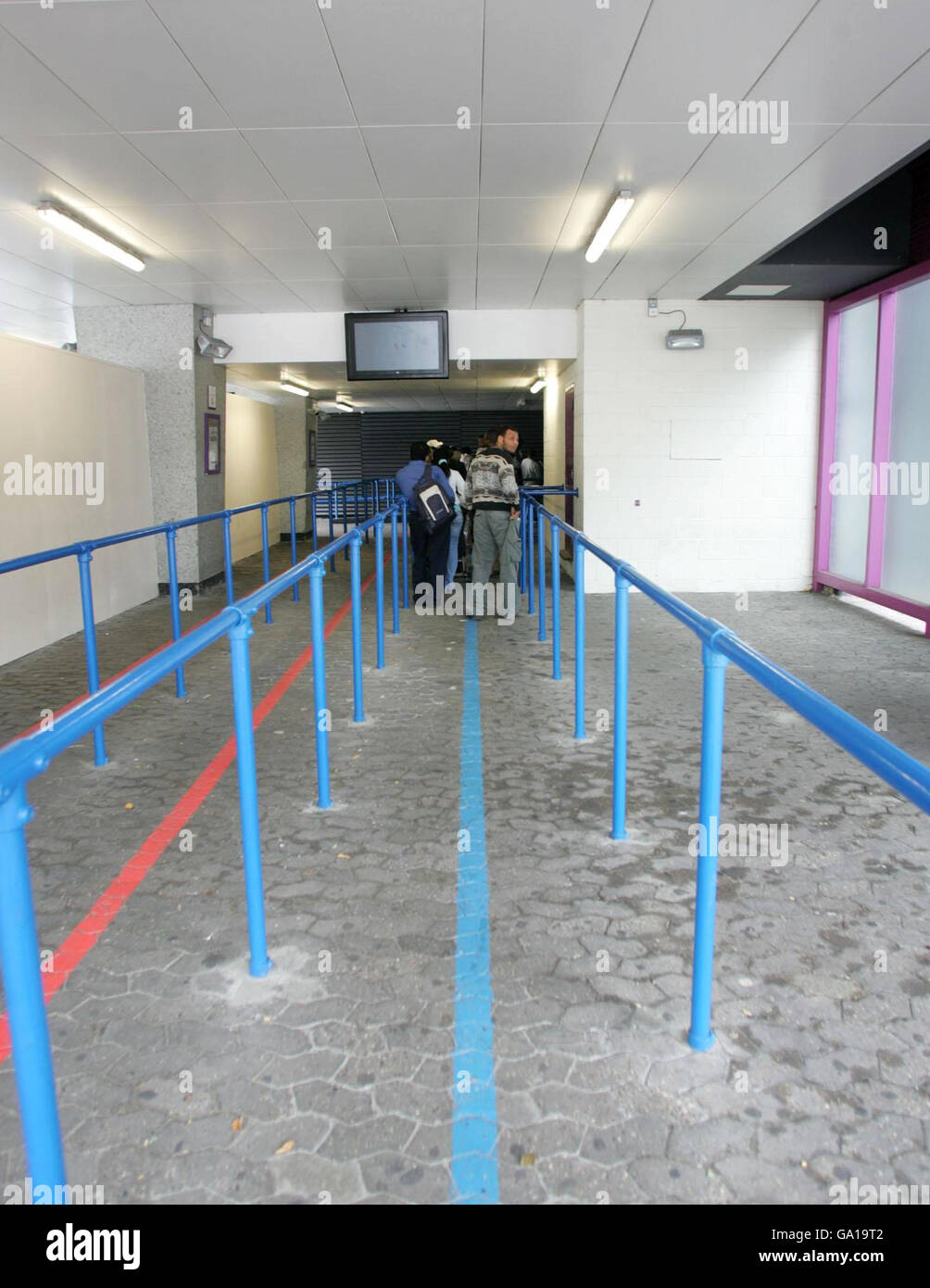 A man waits inside Lunar House, the Home Office Border and Immigration Agency, West Croydon, London. Stock Photo