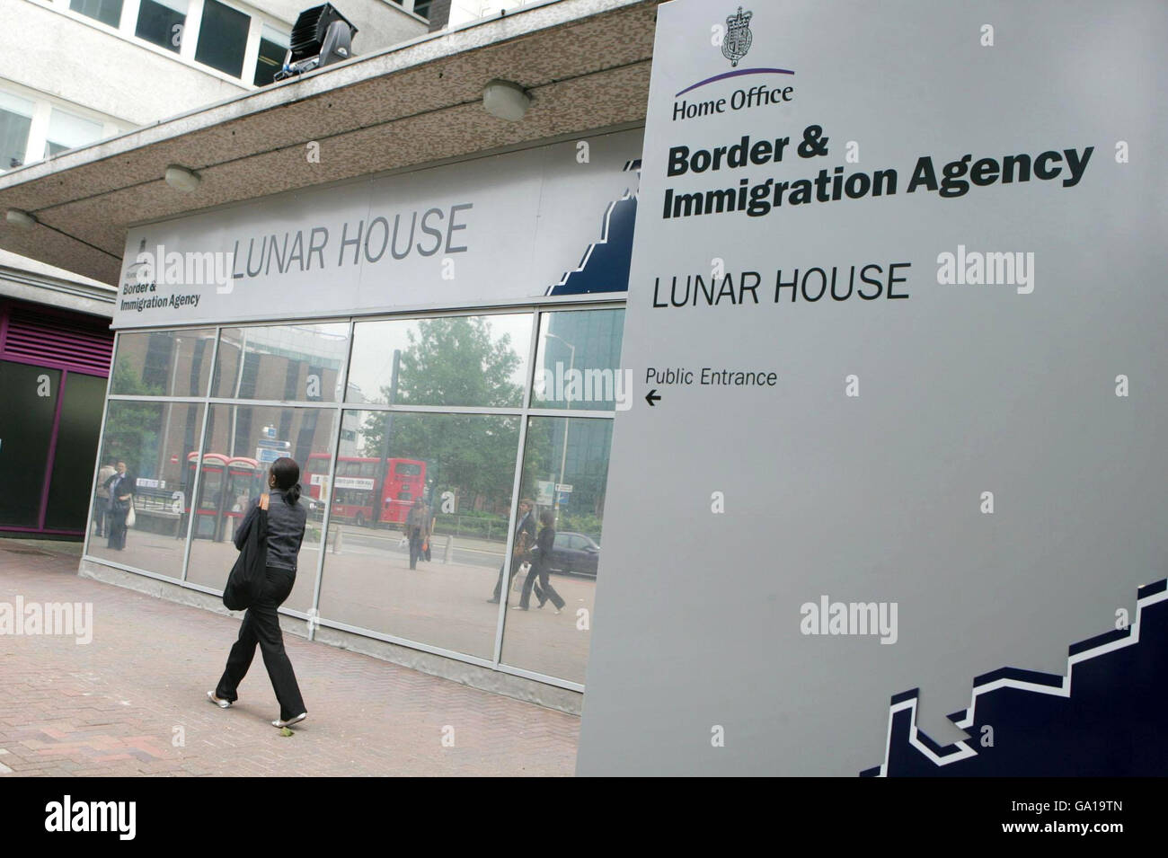 A woman outside Lunar House, the Home Office Border and Immigration