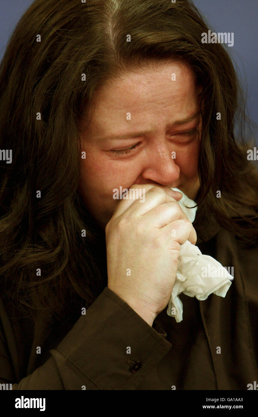 Mary Henry, widow of PC Jon Henry, reacts during a press conference in Luton. Stock Photo