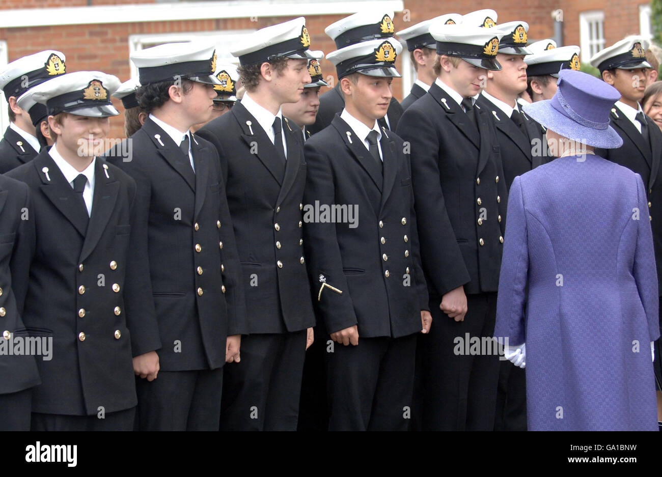 Britain's Queens Elizabeth II meets young sailors after attending a church service to mark the 25th anniversary of the Falkland Islands' liberation at the Falkland Islands Memorial Chapel at Pangbourne College in Berkshire. Stock Photo