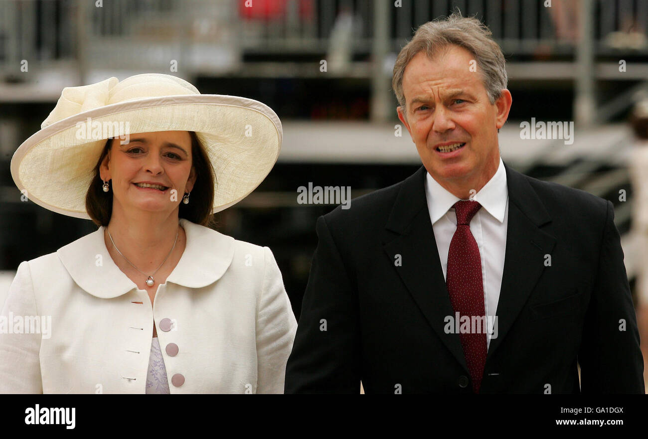 Prime minister tony blair and his wife cherie arrive hi-res stock