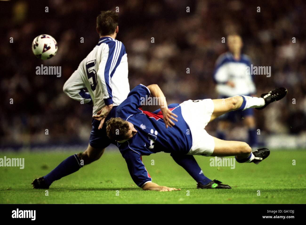 Soccer - UEFA Cup - Second Round - First Leg - Rangers v Dinamo Moscow. Rangers' Tore Andre Flo is upended by Dinamo Moscow's Darius Zutautas Stock Photo
