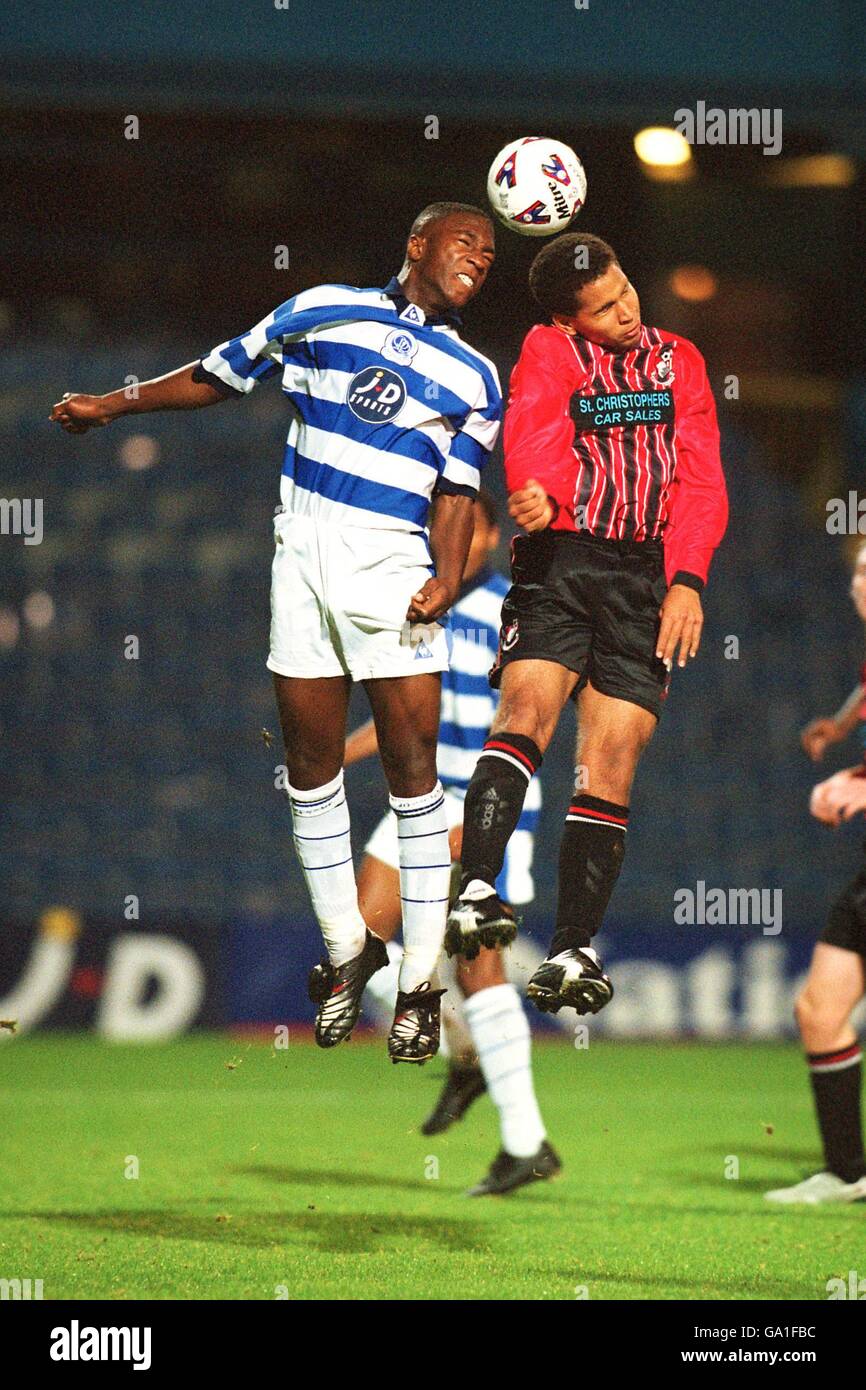 Queens Park Rangers' Irvin Alexander (l) jumps for a header with AFC Bournemouth's Chris Moulder (r) Stock Photo