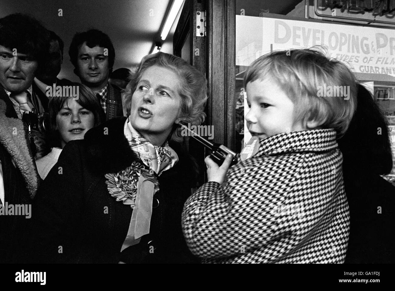 Conservative Party leader Margaret Thatcher, who was visiting Walsall North to support Robin Hodgson, the Conservative candidate in the by-election, pauses to chat to gun toting four year old Carl Tonks. Stock Photo