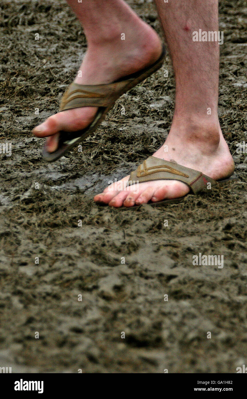 Muddy feet in flip flops hi-res stock photography and images - Alamy