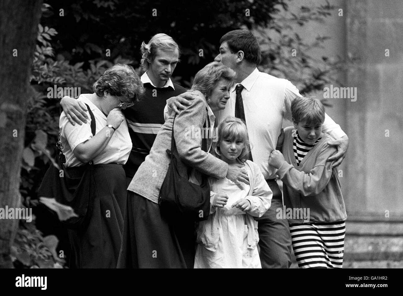 Distraught relatives leave the parish church of St Lawrence in Hungerford after an emotional Holy Communion service following the massacre of 16 townspeople by crazed gunman Michael Ryan. Stock Photo