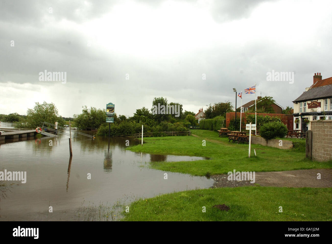 The beer garden of the ferry pub in North Muskham, Nottinghamshire is flooded after the River Trent bursts its banks. Stock Photo