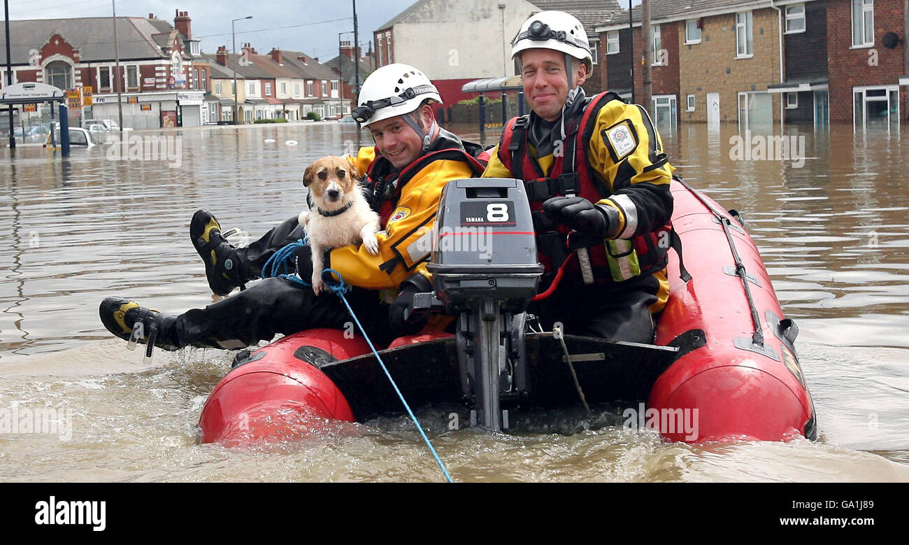 Flooding hits Britain. Firefighters save a dog as flood waters rise in ...