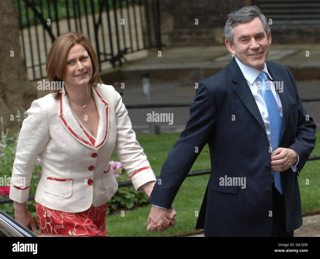 Prime Minister Gordon Brown arrives at 10 Downing Street in London today with his wife Sarah. Stock Photo