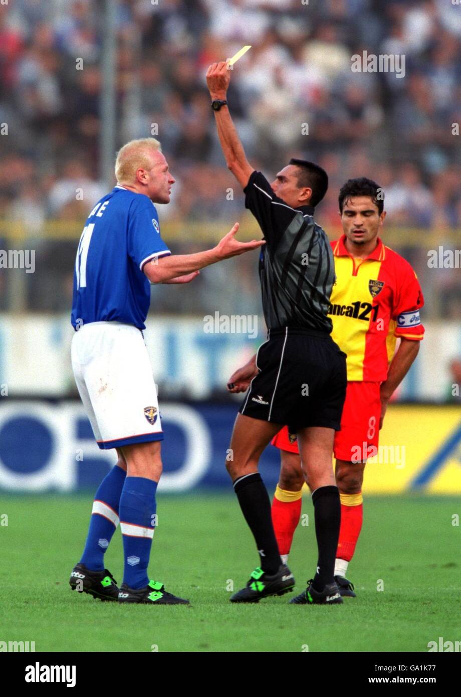 Italian Soccer - Serie A - Brescia v Lecce. The referee shows Brescia's Igli Tare (l) the yellow card Stock Photo