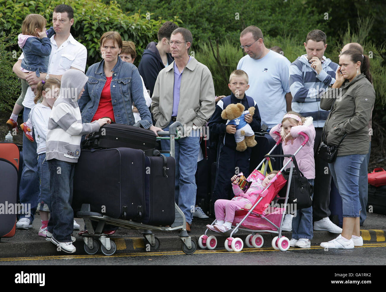 Passengers queue at Glasgow Airport this morning following a dramatic attack on the terminal building yesterday. Stock Photo