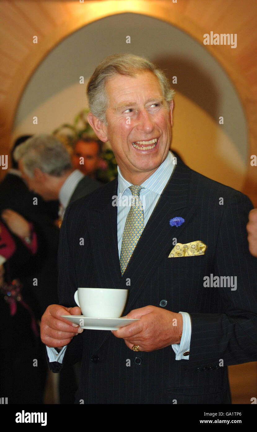 The Prince of Wales is seen standing by a wooden horseshoe arch by carpenter Tom Fraser, at the degree show of The Prince's School of Traditional Arts in east London. Stock Photo