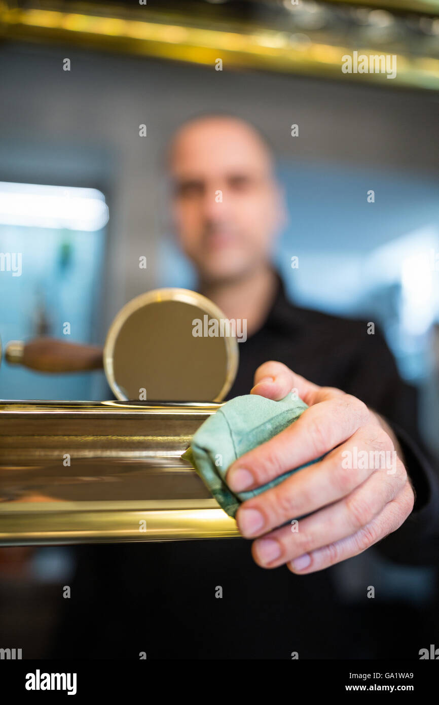 Bar tender cleaning beer pump Stock Photo Alamy