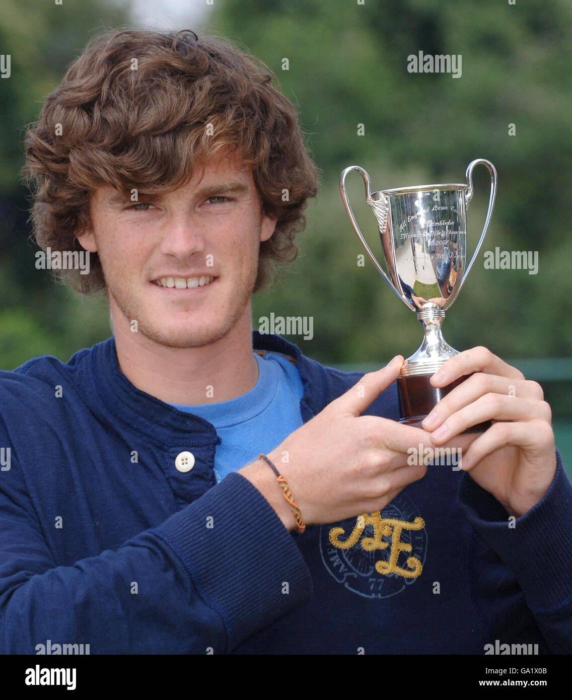 British tennis champion Jamie Murray shows off his Wimbledon Mixed