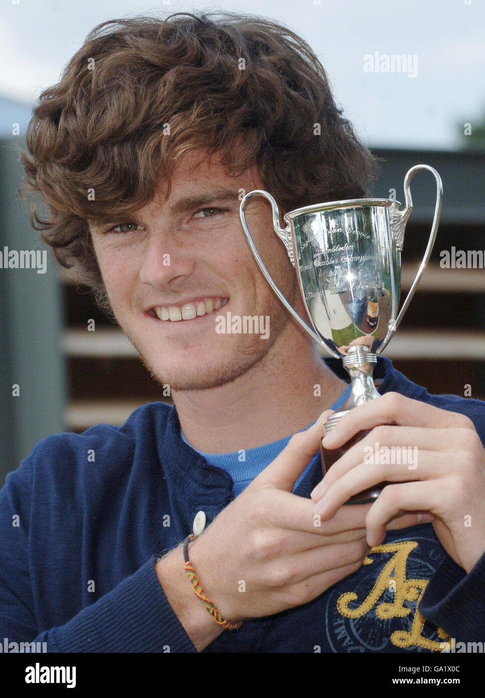 British tennis champion Jamie Murray shows off his Wimbledon Mixed