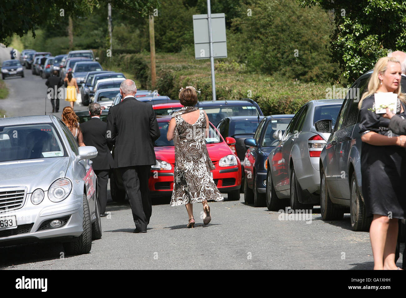 Guests arrive for the wedding of Cian Foley and Sue Ann McManus, daughter  of racing tycoon JP McManus, at Martinstown Church, Co Limerick Stock Photo  - Alamy, image size:1300x956