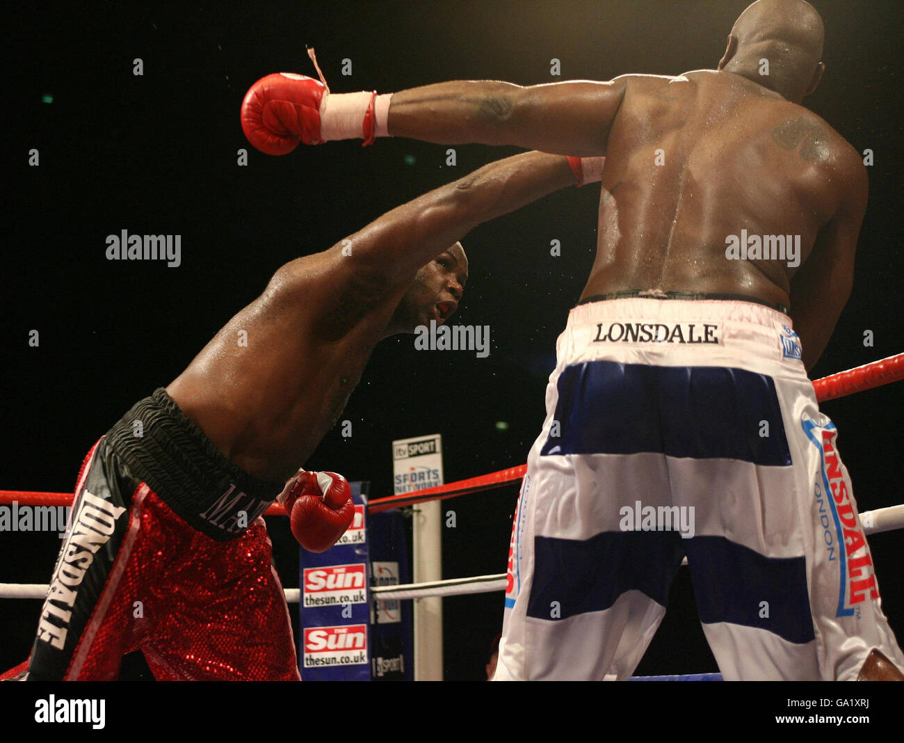 England's Matthew Skelton (left) in action against Michael Sprott during the Commonwealth Heavyweight Championship fight at the O2 Arena, London. Stock Photo