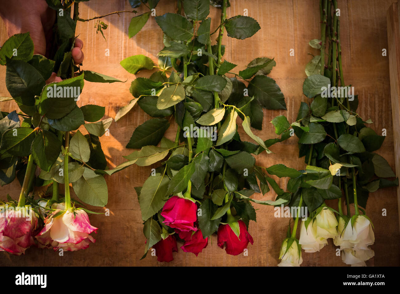 Flowers on the wooden worktop at flower shop Stock Photo Alamy