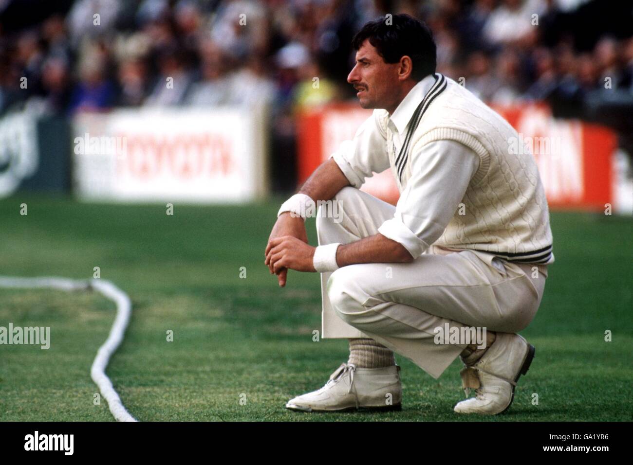 New Zealand's Richard Hadlee watches the match from the other side of the boundary rope after retiring hurt Stock Photo