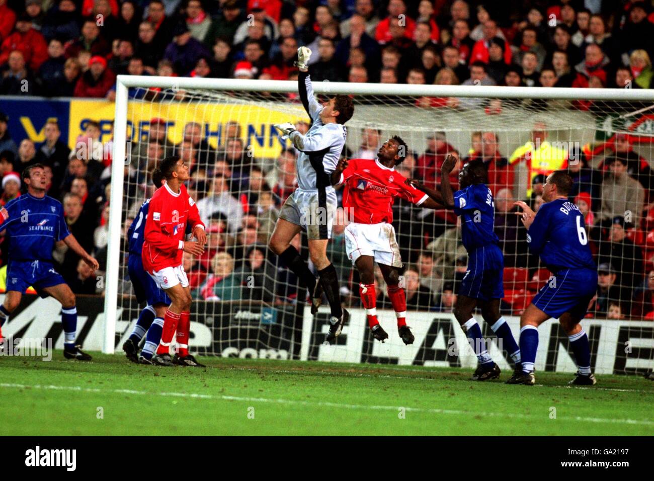 Gillingham goalkeeper Vince Bartram punches the ball clear Stock Photo