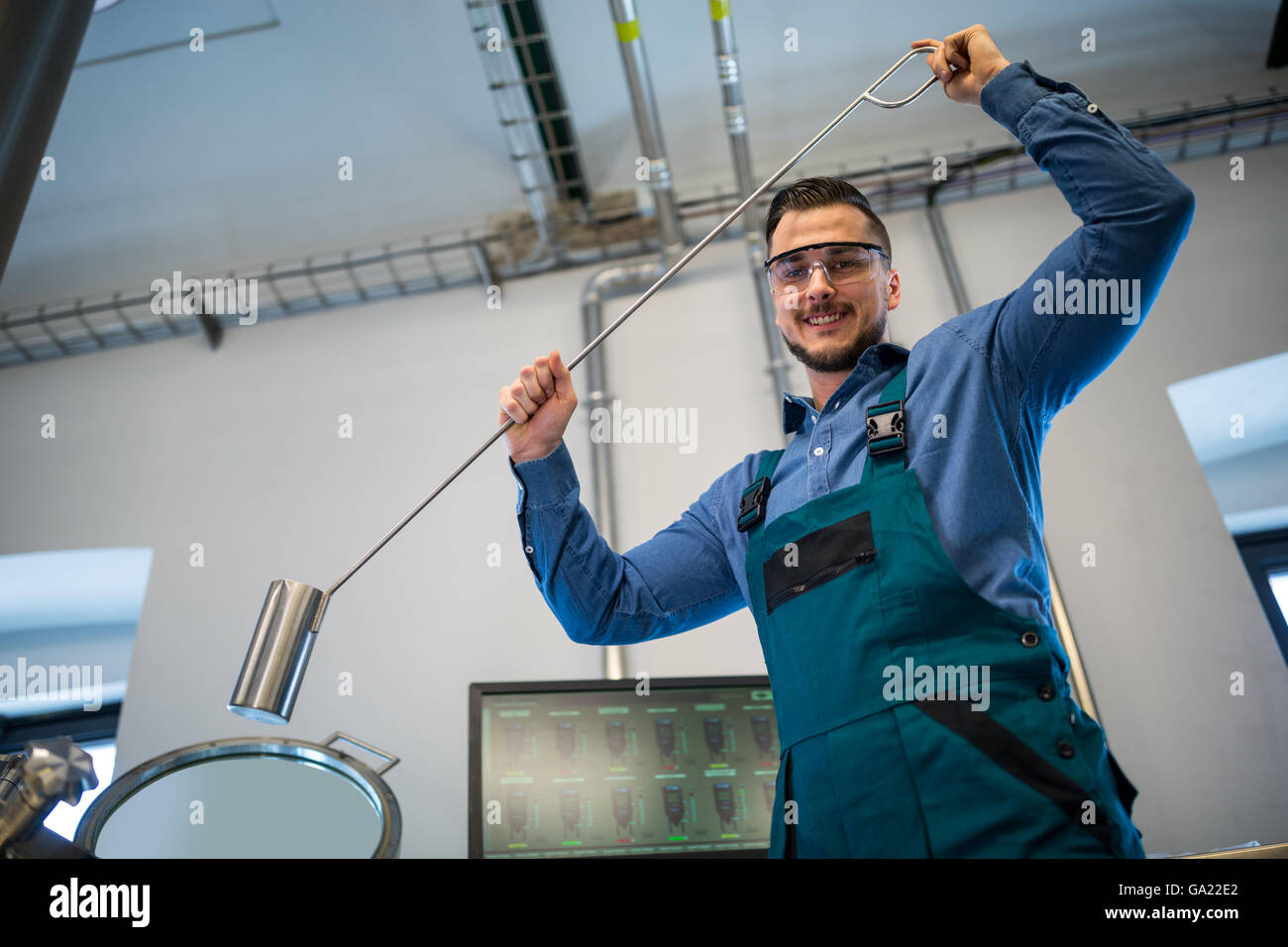 Brewer working at brewery Stock Photo