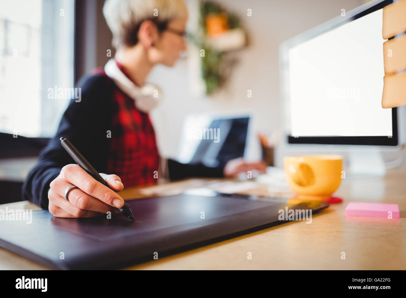 Person Using Graphics Tablet Graphic designer using graphics tablet Stock Photo - Alamy