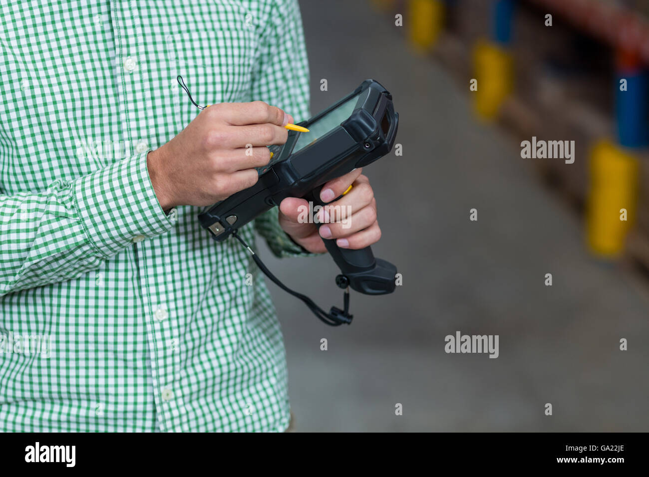 Close up of worker is using a electronic tool Stock Photo