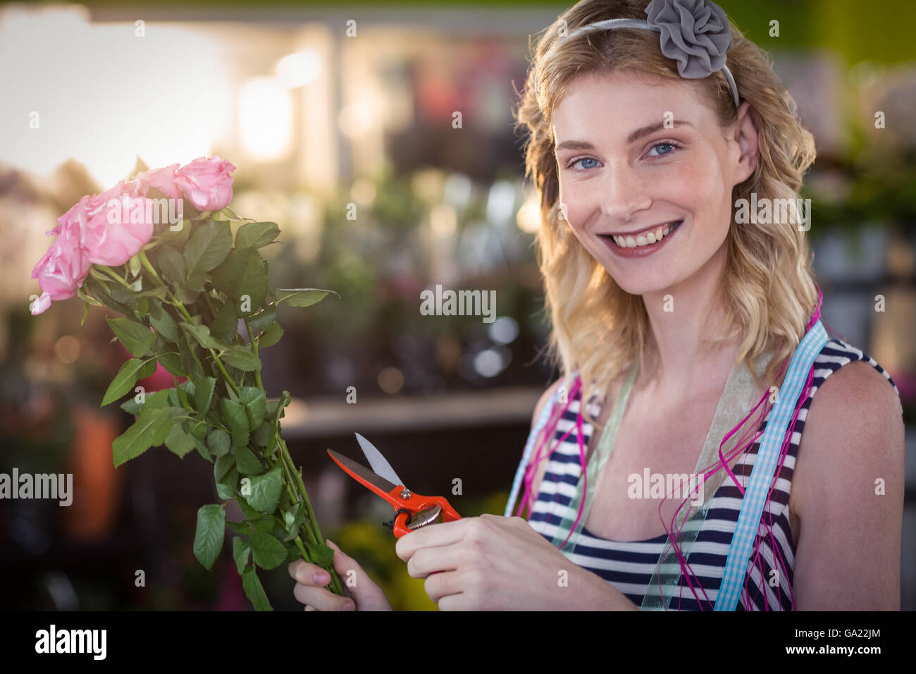 Female florist preparing flower bouquet Stock Photo - Alamy