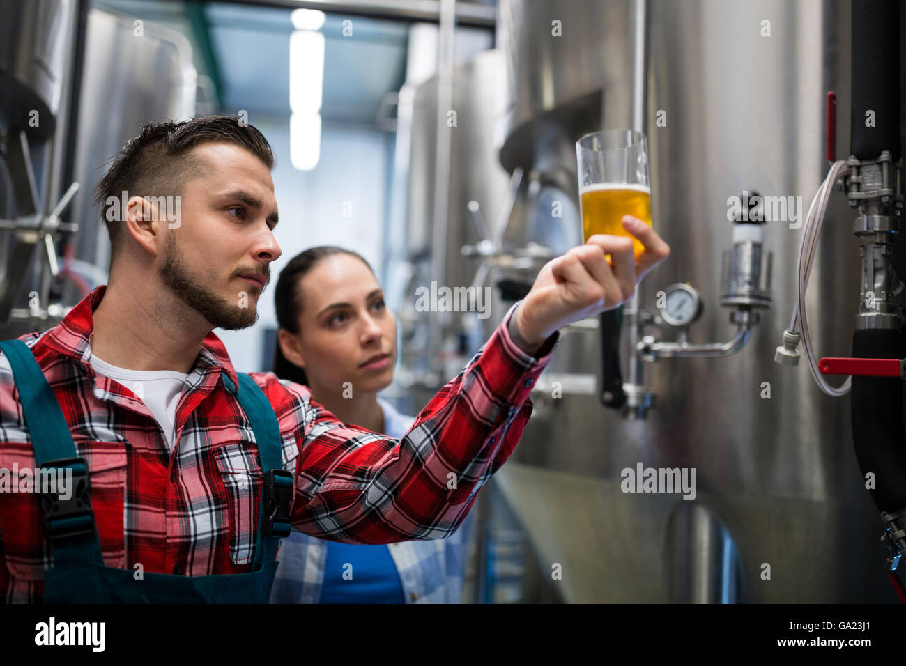 Brewers testing beer Stock Photo