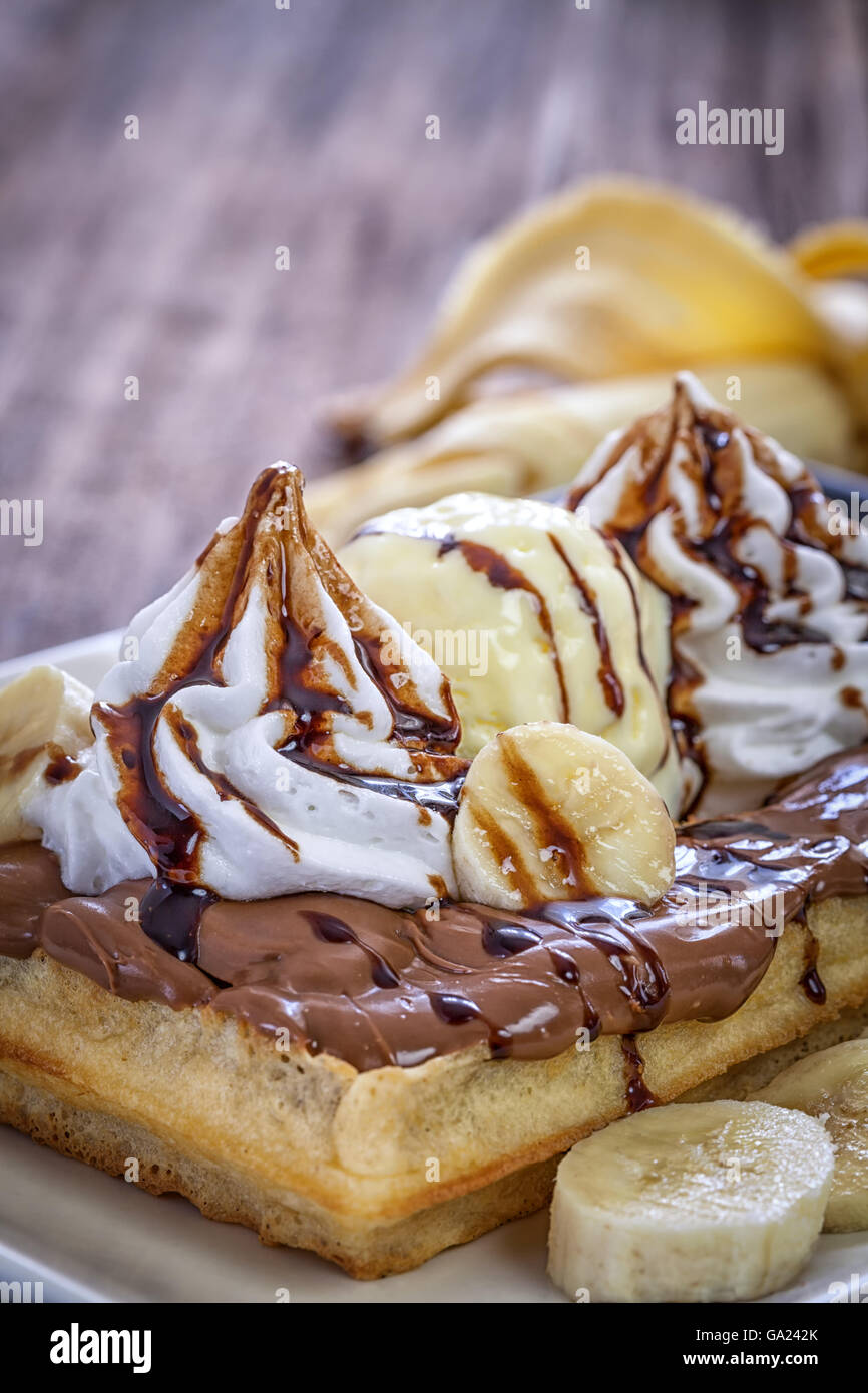 Belgian Waffles with banana and vanilla ice cream Stock Photo - Alamy