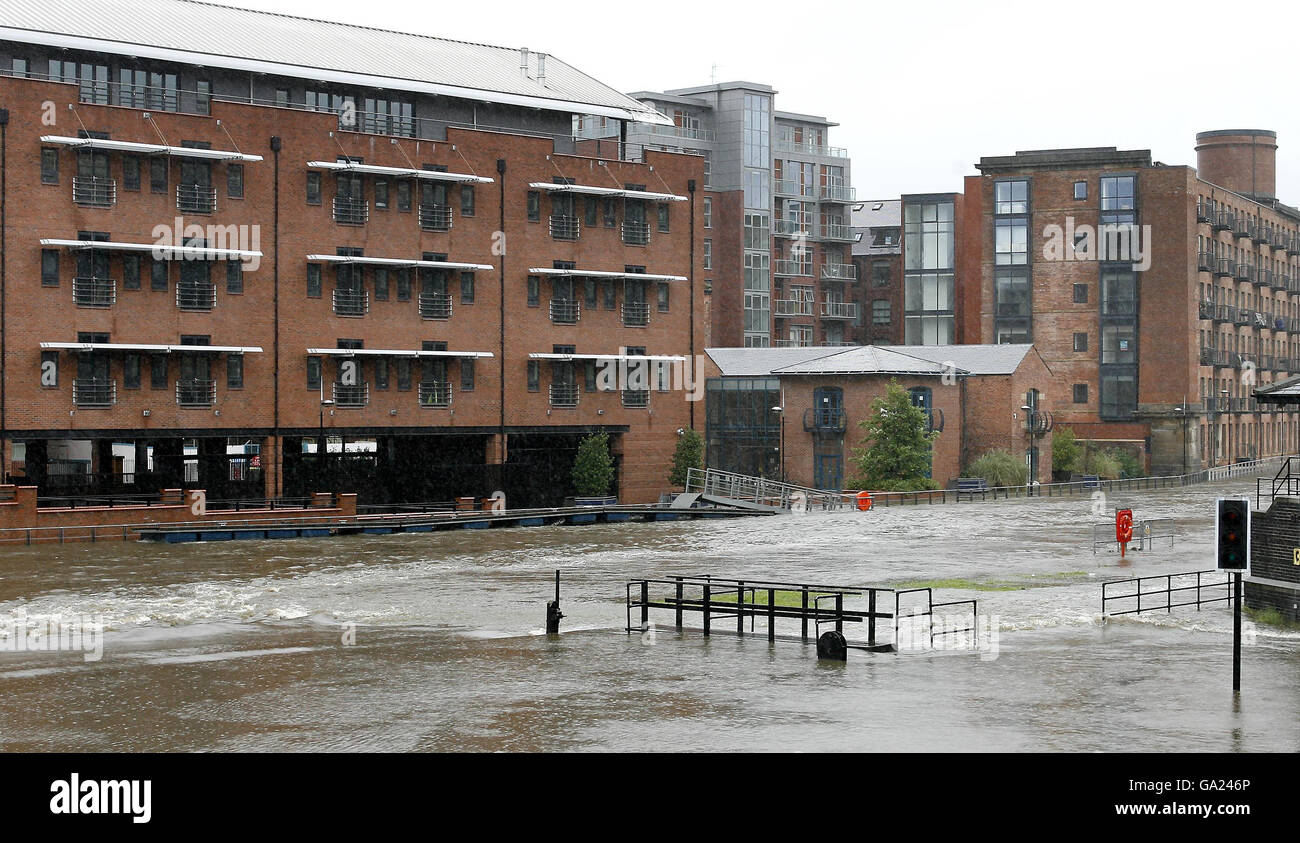 The banks of the River Aire in Leeds city centre are broken as heavy ...