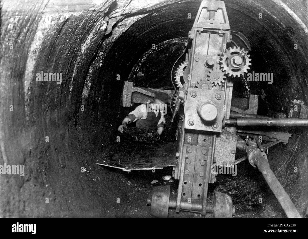 British Industry, Mining. A coal cutting machine at work. Stock Photo