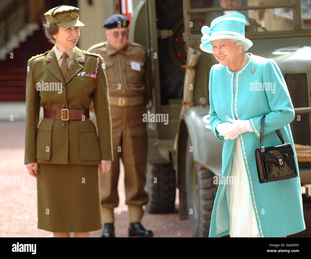 Britain's Queen Elizabeth II, with the Princess Royal (left) inspects