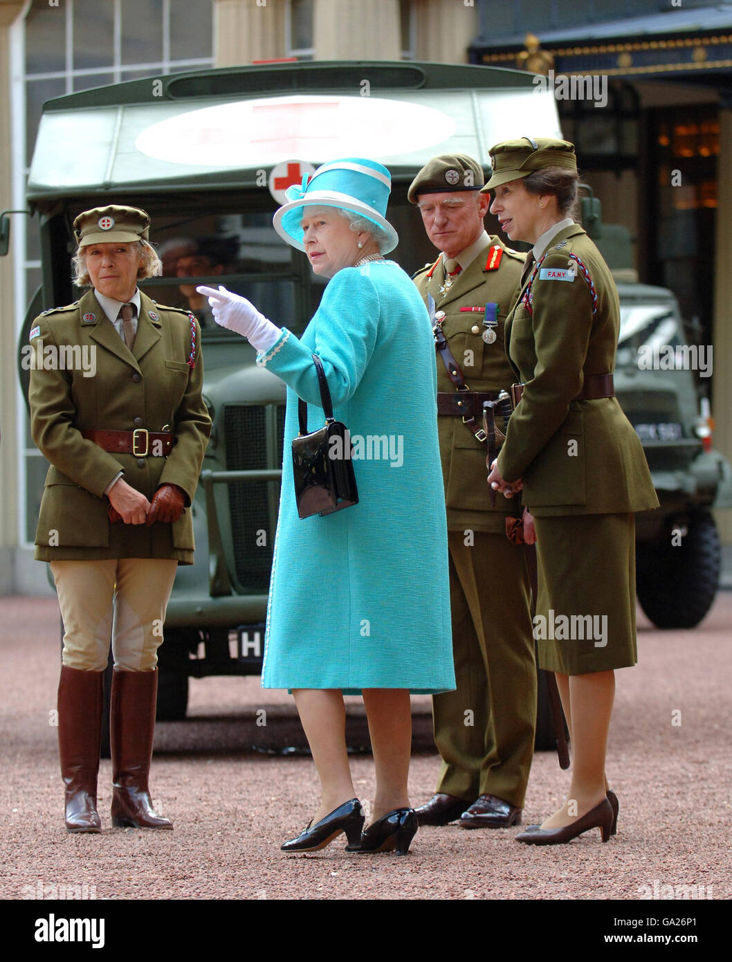 Britain's Queen Elizabeth II, with the Princess Royal (right), inspects