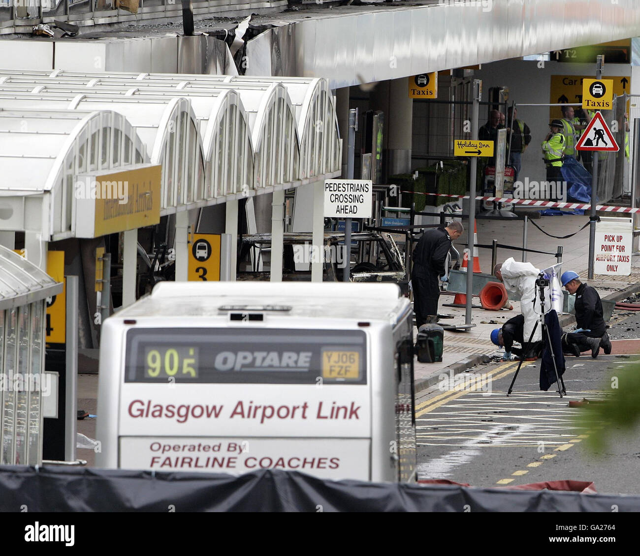 Forensic police officers at Glasgow Airport this morning following a dramatic attack on the terminal building yesterday. Stock Photo