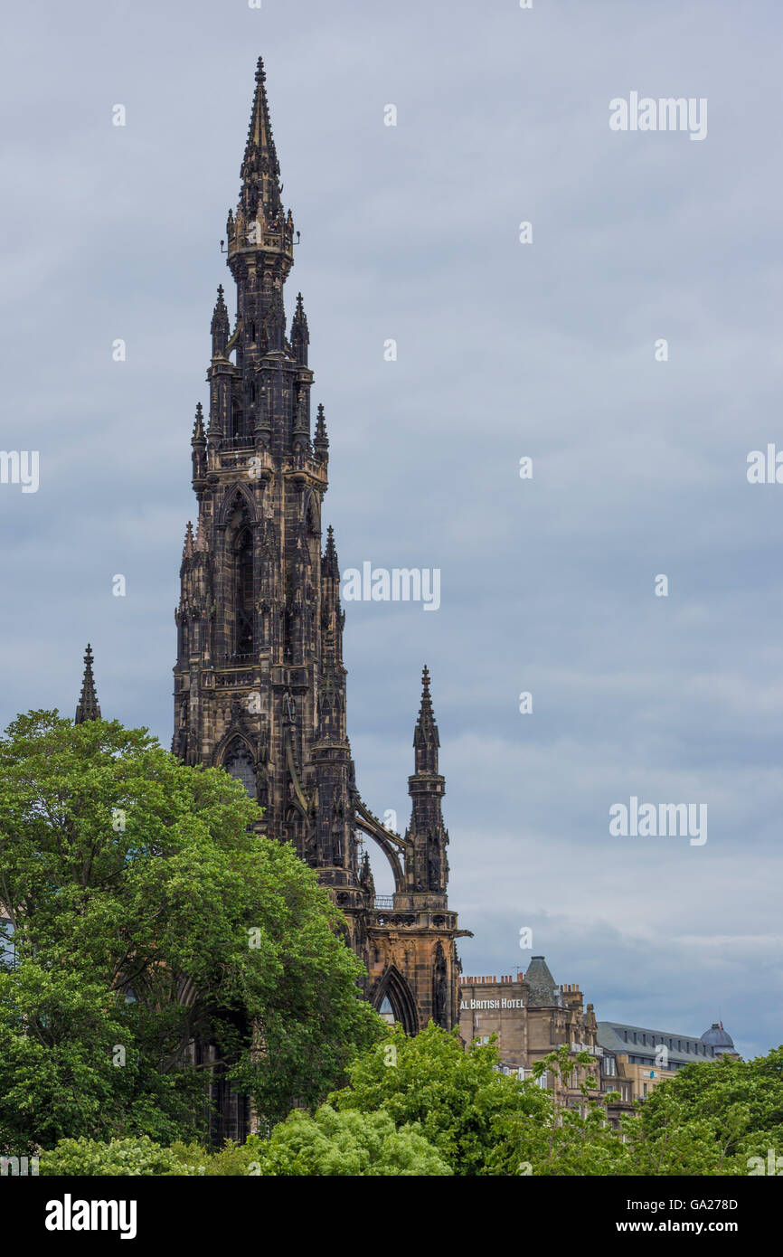 Scots Monument behind the trees of princess street gardens in Edinburgh Stock Photo Alamy