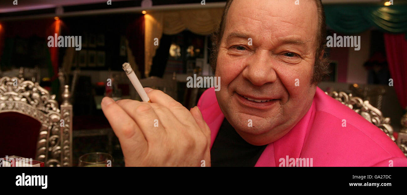David West, the Manager of Hey Jo members club on Jermyn Street, London, smoking in the club after the smoking ban to prove his club is going to ignore the smoking ban. Stock Photo