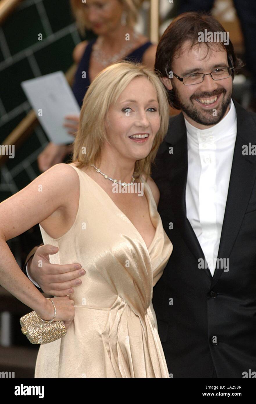 J.K. Rowling and her husband Neil Murray arrive for the UK Premiere of Harry Potter And The Order Of The Phoenix at the Odeon Leicester Square, central London. Stock Photo