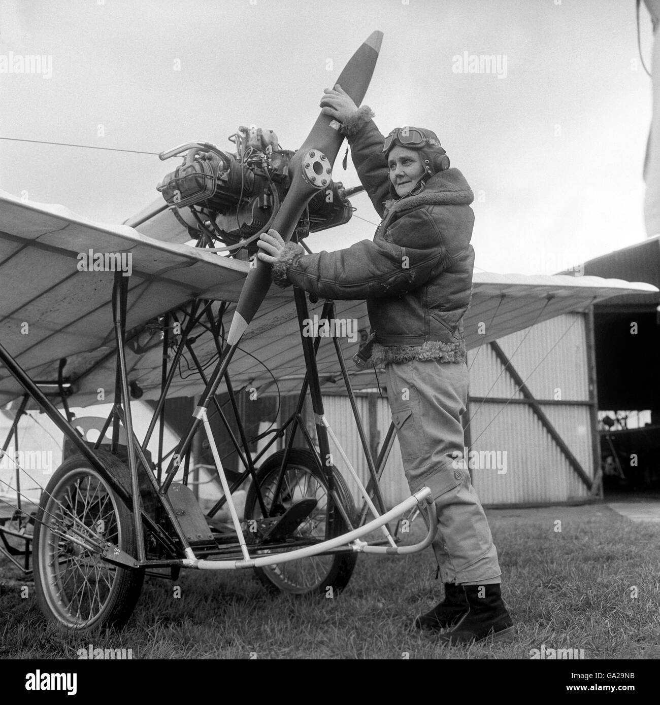 Forty-five year old Miss Joan Hughes, a test pilot and instructress at the Airways Flying Club, White Waltham, near Maidenhead, Berkshire, prepares to fly a Demoiselle monoplane which has been built - correct to the last detail - for a new Twentieth Century Fox picture, 'Those Magnificent Men in their Flying Machines' Stock Photo