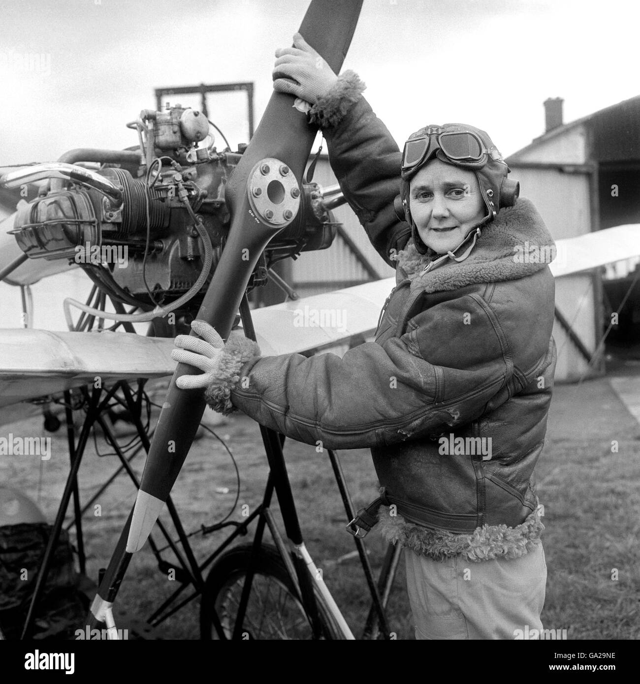 Joan Hughes, a test pilot and instructor at the Airways Flying Club, White Waltham, near Maidenhead, Berkshire, prepares to fly a Demoiselle monoplane which has been built, correct to the last detail, for a new 20th Century Fox picture, 'Those Magnificent Men in their Flying Machines'. Stock Photo