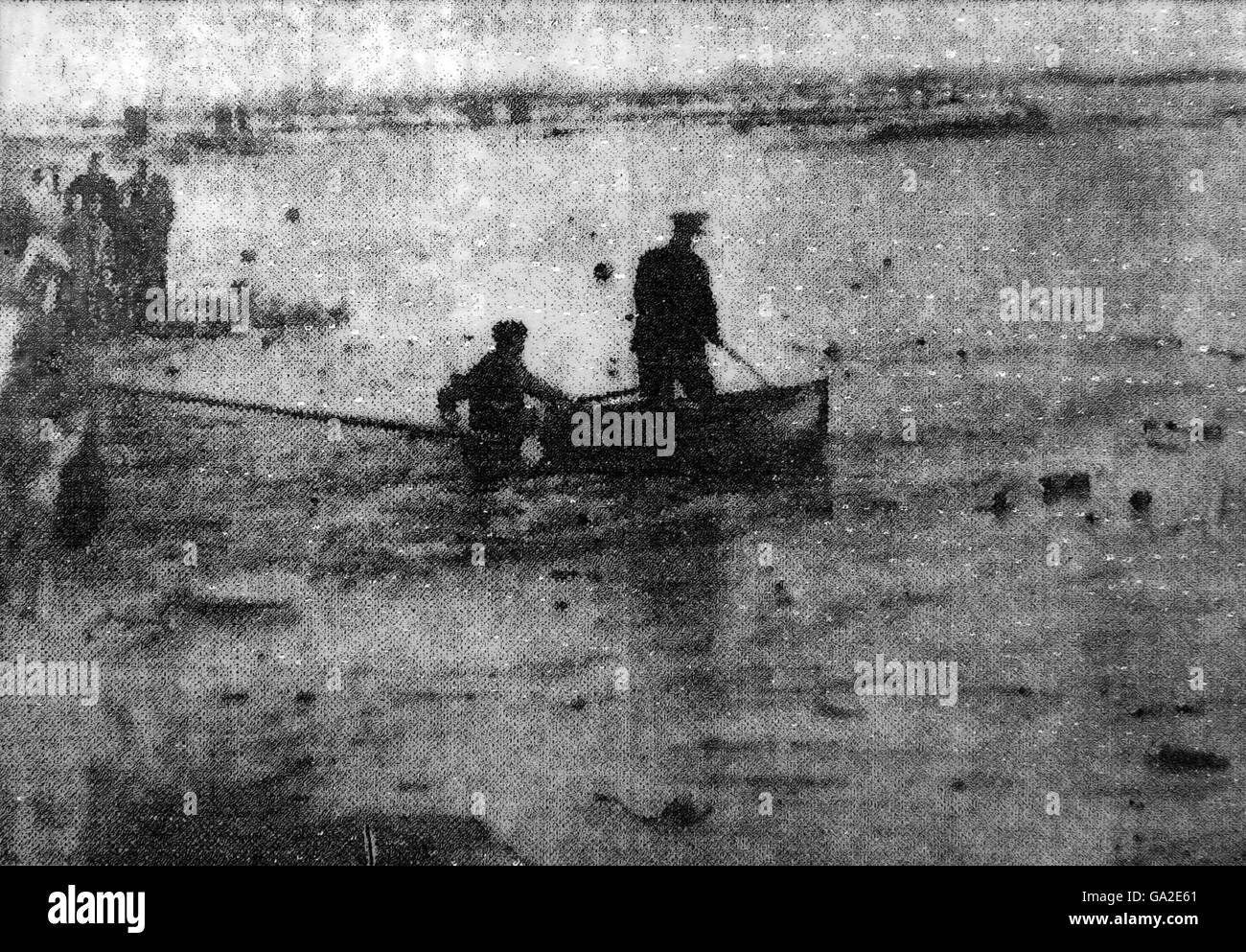 Collect image dated circa 1947 ofshowing Garda searching a flooded quarry in south Dublin for the bodies of three boys who drowned when they fell through ice. Stock Photo