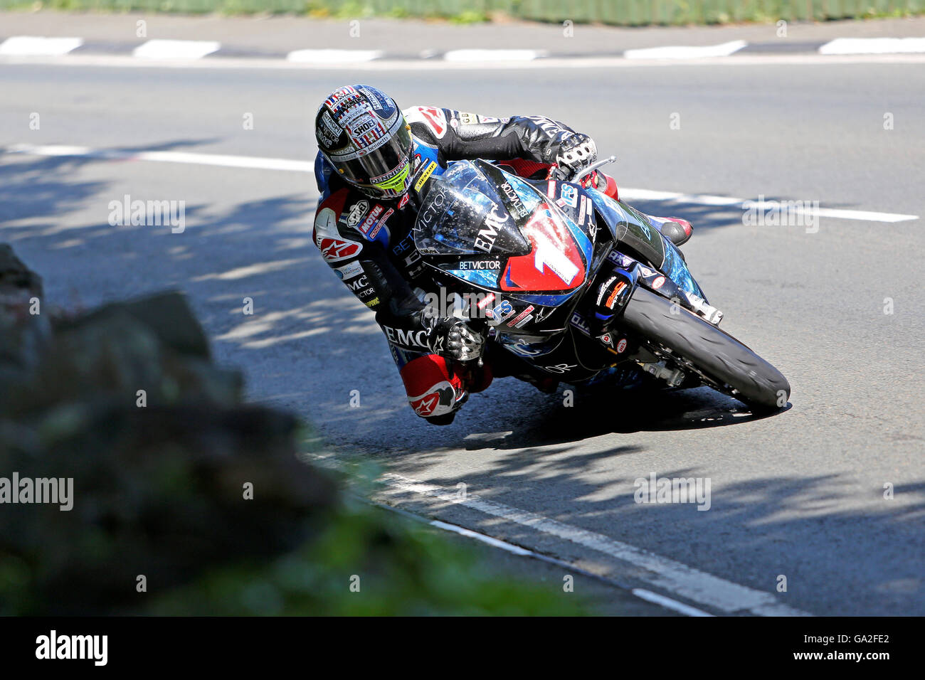 John McGuinness during the 2016 Superstock TT race on the Isle of Man on a Honda CBR1000RR on the approach to Ramsey Hairpin. Stock Photo
