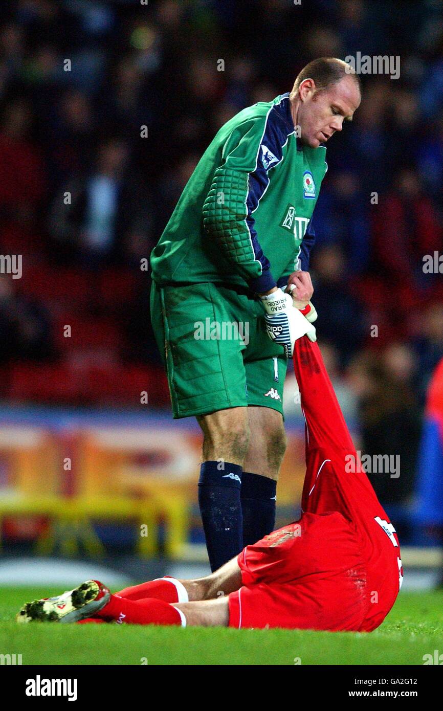 Blackburn Rovers' goalkeeper Brad Friedel gives a helping hand to