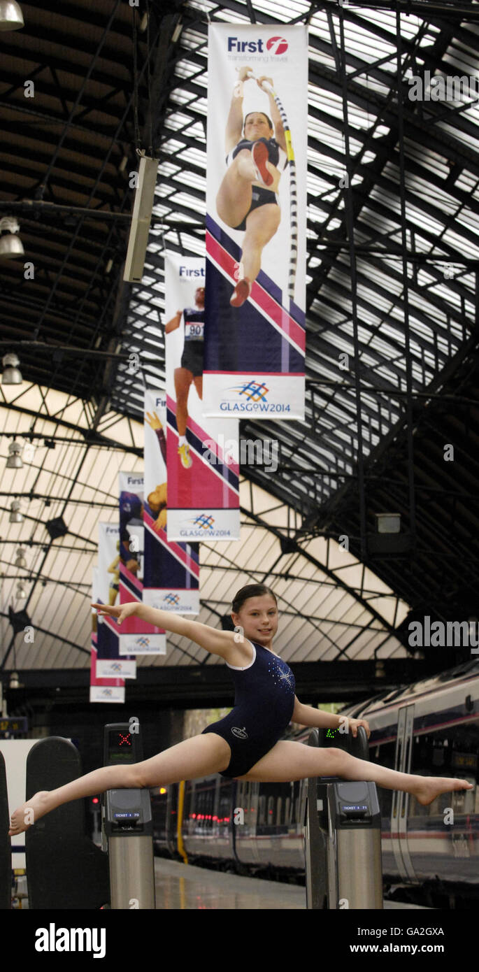 Brooklyn McDonald, 10, member of the Scotland Gymnastics Youth Squad, promotes new 2014 Commonwealth Games branding at Glasgow's Queen Street Station. Stock Photo