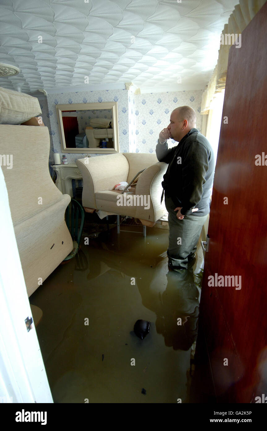 Returning home for a few possessions, Carl Harris of Toll Bar near Doncaster went back to his house in the village for the first time today since the floods..The house was still badly flooded but is lowly receding. Stock Photo