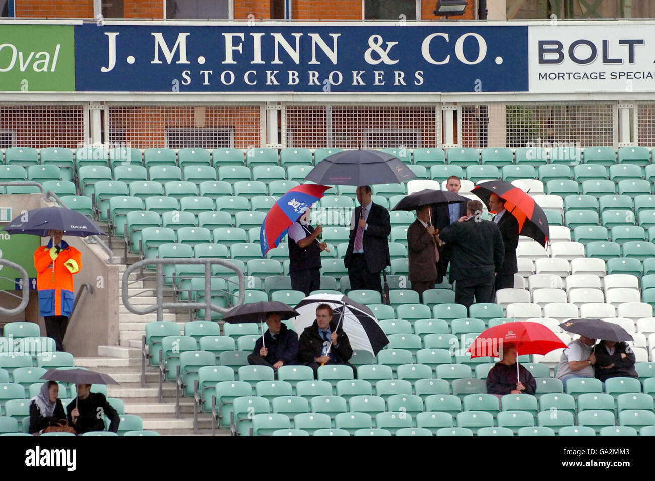 Cricket - Twenty20 Cup 2007 - South Division - Surrey Brown Caps v Sussex Sharks - The Brit Oval. Surrey Brown Caps' fans watch the rain come down at The Brit Oval Stock Photo