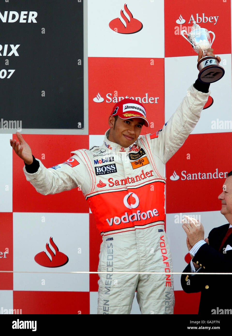 Ferrari's Kimi Raikkonen with the winners trophy on the podium after  winning the British Grand Prix at Silverstone, Northamptonshire Stock Photo  - Alamy