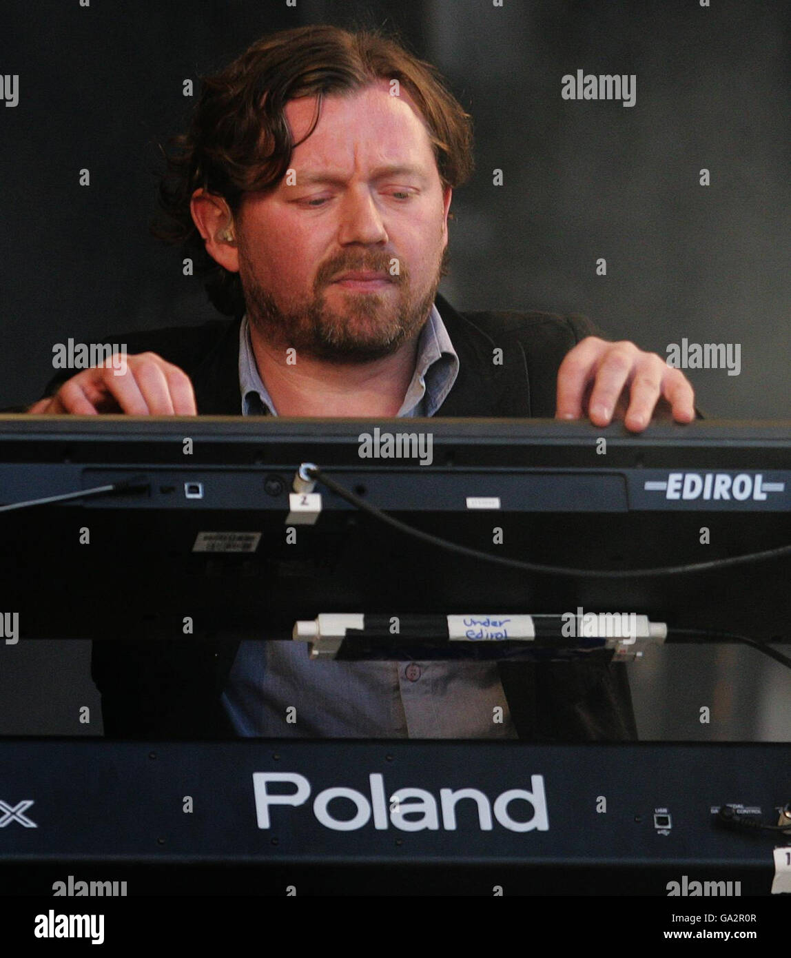 Snow Patrol keyboard player Tom Simpson performs at the T in the Park music  festival at Kinross in Scotland Stock Photo - Alamy