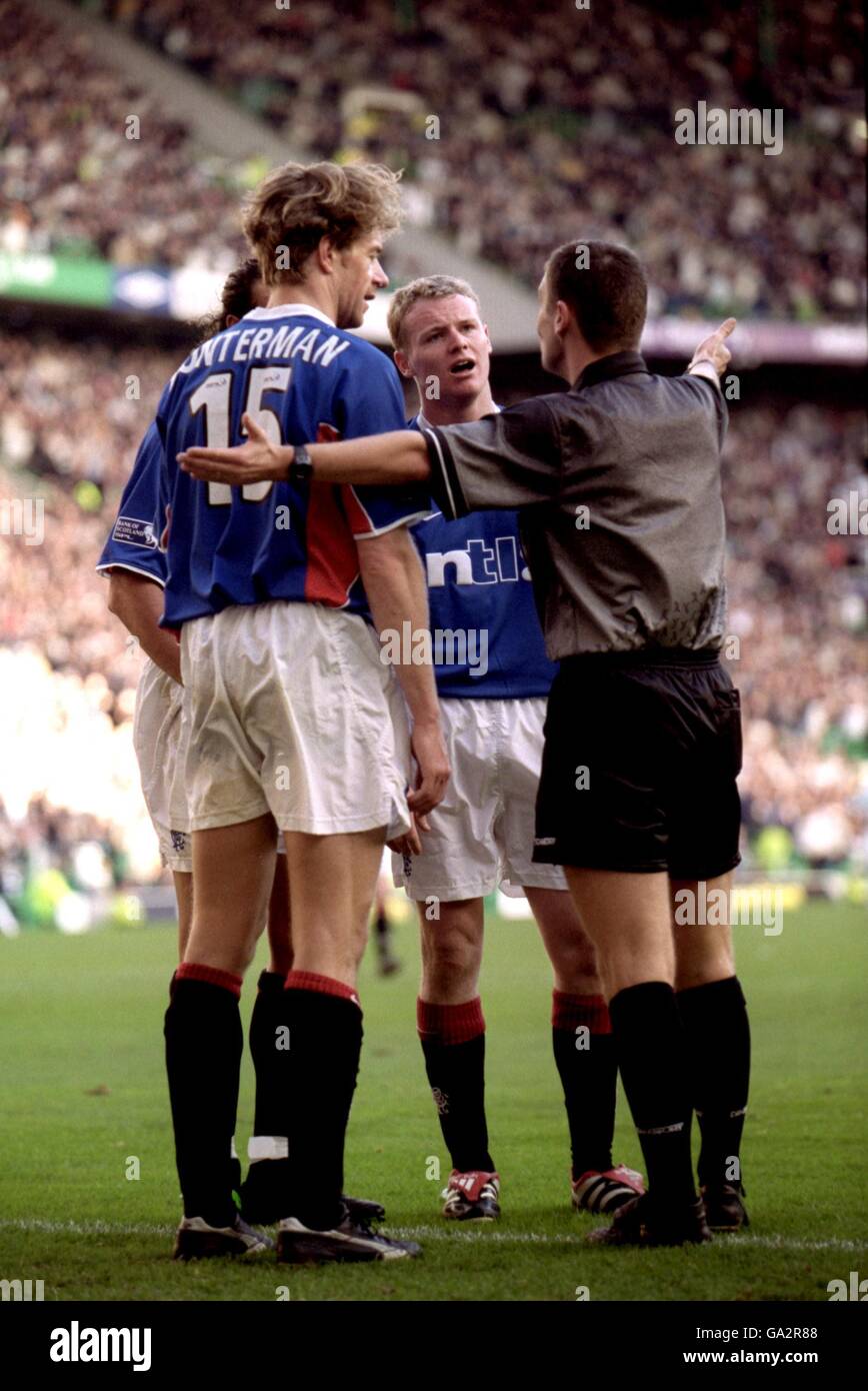 Rangers' Bert Konterman and Michael Ball argue with the referee during