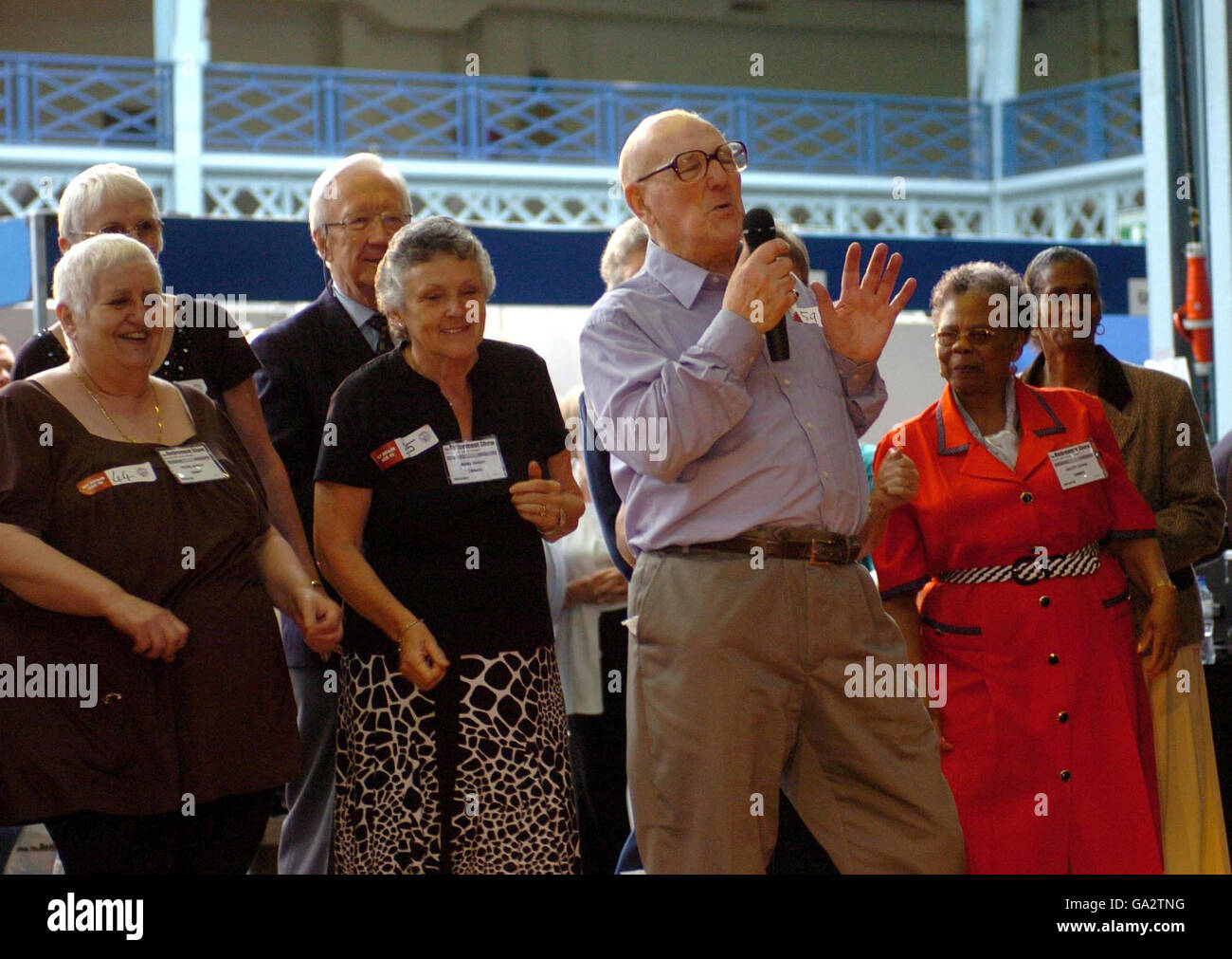 Alf Carretta, aged 90, lead singer of The leads the group in their version of The Who's 'My Generation', at the Retirement Show, Olympia, today Photo - Alamy
